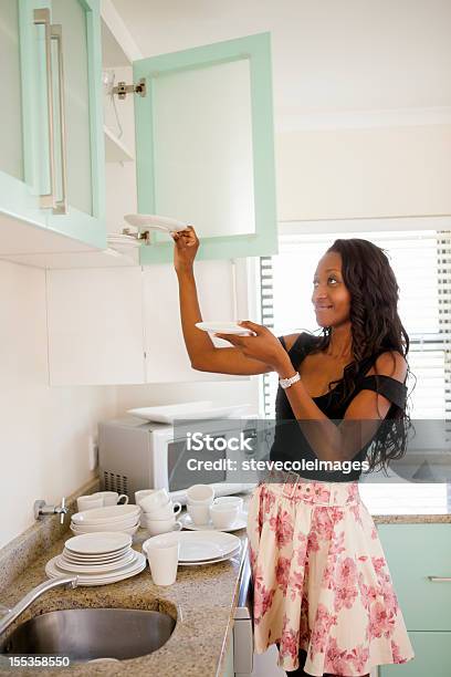 Organizing Kitchen Stock Photo - Download Image Now - Adult, African Ethnicity, Cheerful