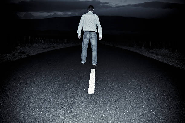 istock Man Stood on a dark country road 155358569