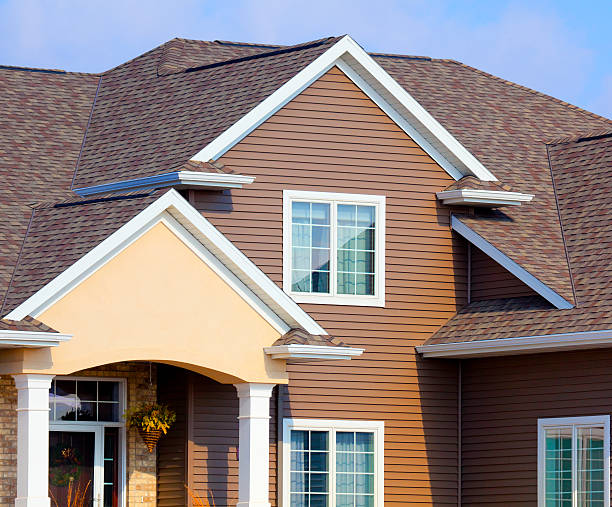 istock New Home With Brick, Stucco, and Brown Vinyl Siding 155358649