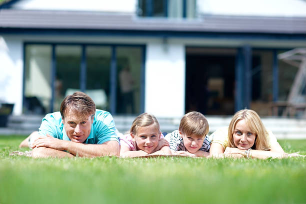 istock Family soaking up the summer sun together 155358859