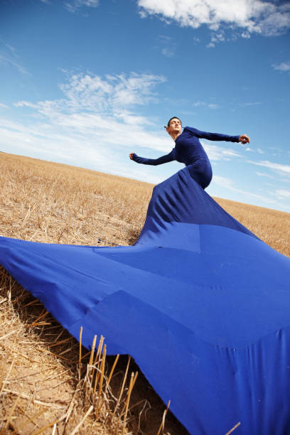 istock Woman wearing tent dress in cornfield 155358921