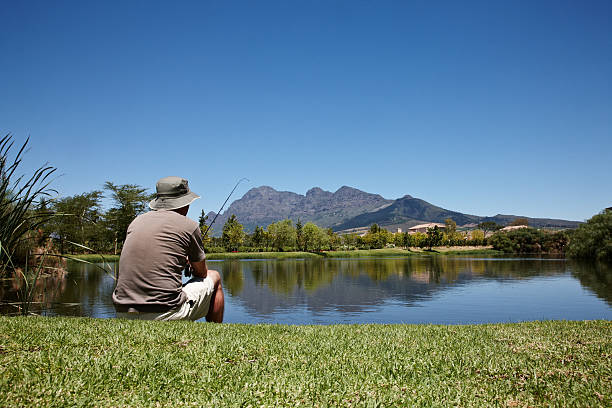 istock Man fishing at a lake 155359107