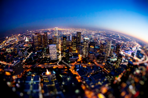 Aerial shot of downtown Los Angeles, CA at night. Photographed with fish-eye lens. Some noise due to low light and high ISO. Shot from R22 helicopter.