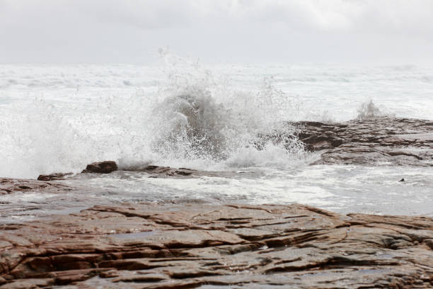 istock Crashing waves on rocky shoreline 155359671