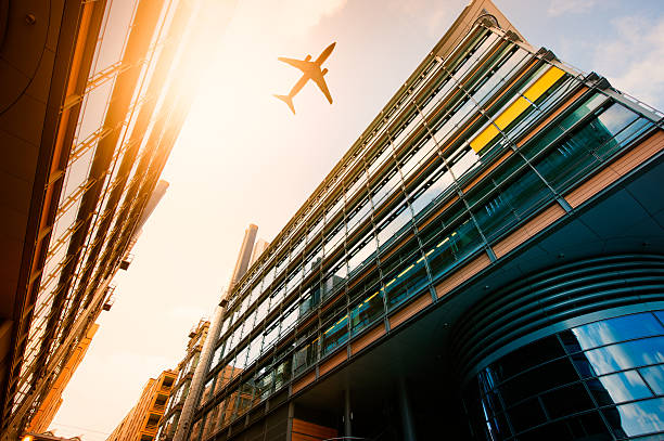istock Futuristic office buildings with a airplane silhouette 155359686