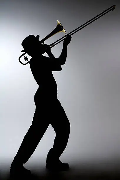 Silhouette a jazz musician play of trombone