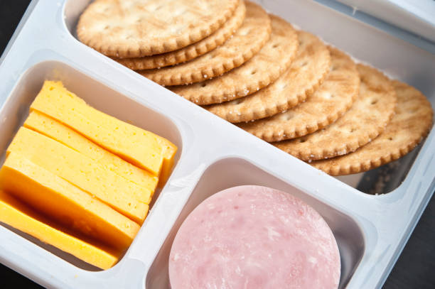 istock Crackers, sliced cheese and ham in a plastic tray 155359875