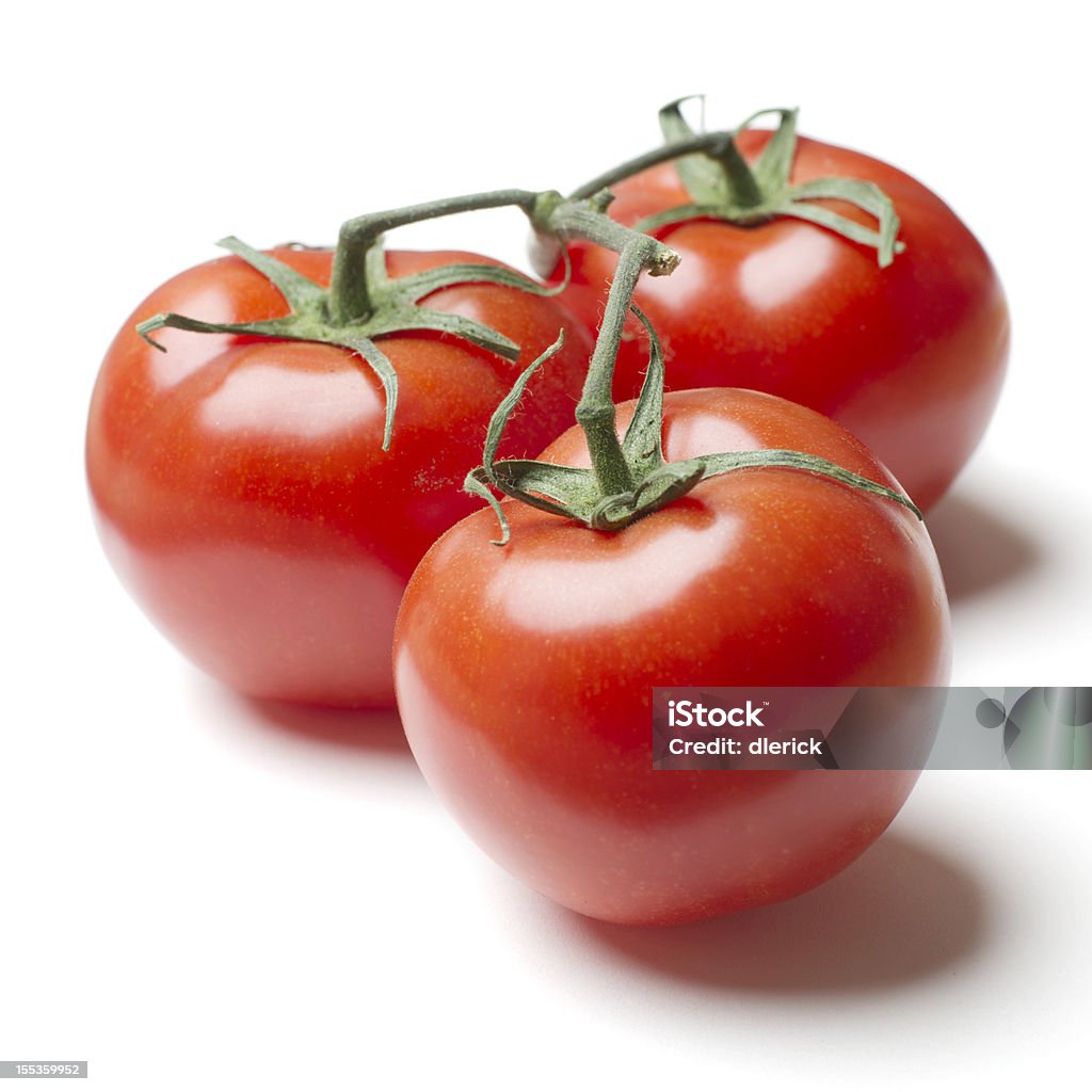 Tres Tomates en Vine - Foto de stock de Tomate libre de derechos