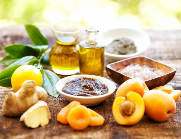 istock Spa still life with organic scrub, massage oil, apricots, ginger 155360042