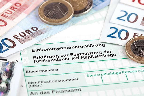 German Tax Form with Euro banknotes and coins  five euro banknote photos stock pictures, royalty-free photos & images