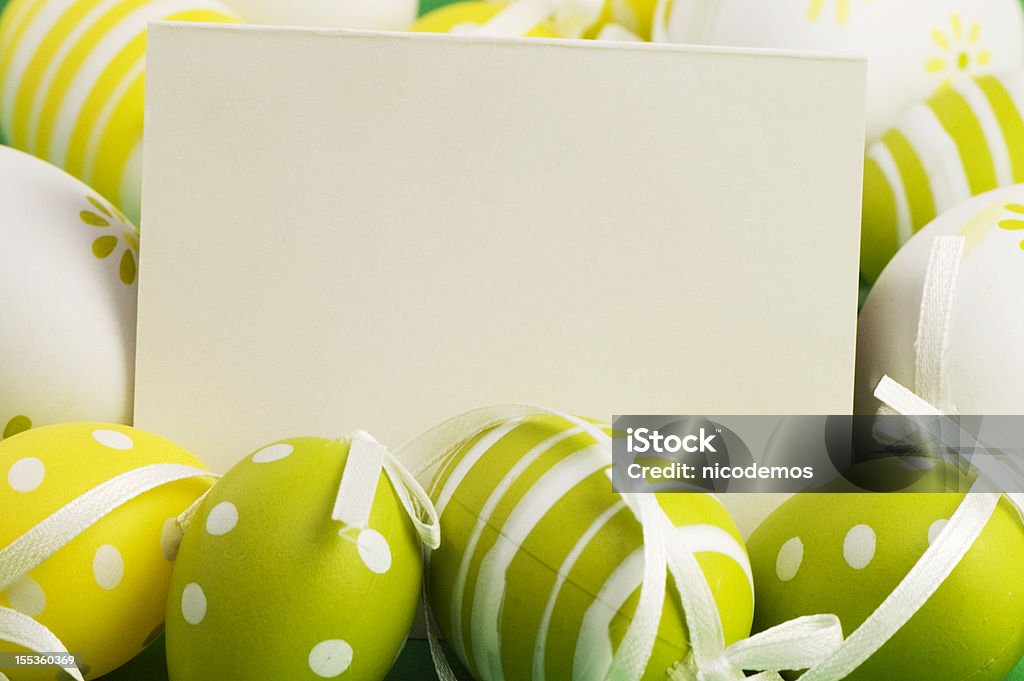 Easter Greetings Green-Yellow Easter Eggs and Blank Card for your own Easter Greetings.  Easter Stock Photo
