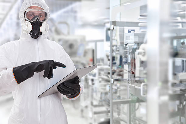 junge wissenschaftler - protective suit stock-fotos und bilder