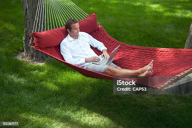 Man Working On Laptop At Home Stock Photo - Download Image Now - Hammock, Yard - Grounds, Men