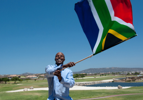 Man Waving a South African Flag