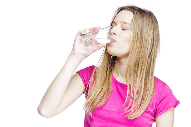 istock young beautiful woman drinking water 155361414