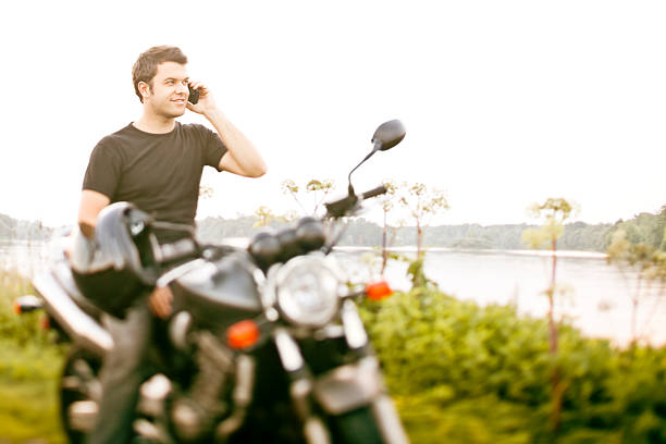 Smiling biker stopping for a break. Tilt-shift used, focus is on face. 