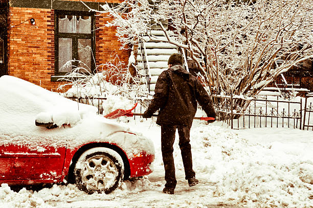 istock Man shoveling snow around his car. 155361841