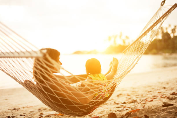 istock mother and baby in hammock 155361921