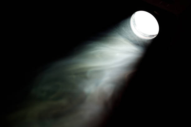 istock a ray of light in the dark, smoke in the light 1553620898