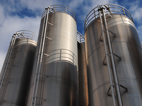 silos made of metal against sky