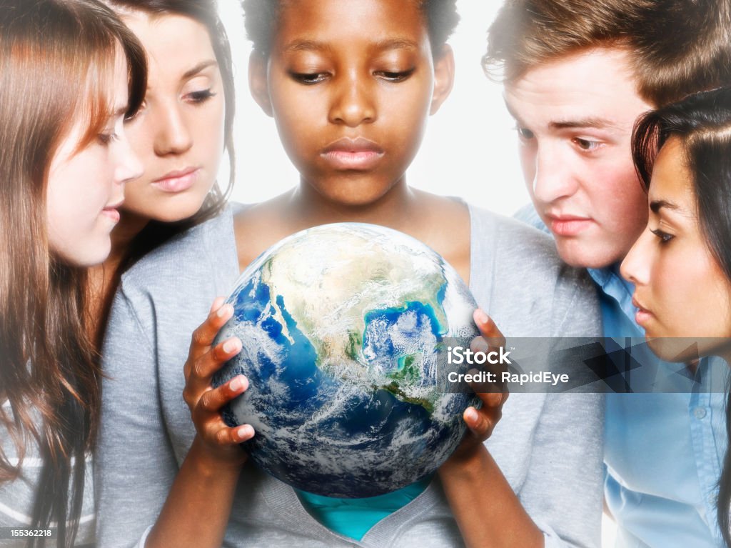 Concerned young people caring for Mother Earth  Globe - Navigational Equipment Stock Photo