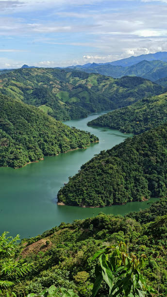 istock Natural landscape with crystalline and green river surrounded by mountains. 1553632745