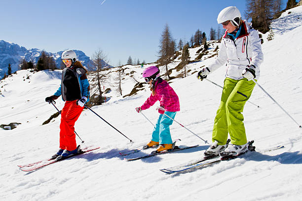 Ski family in Moountains stock photo