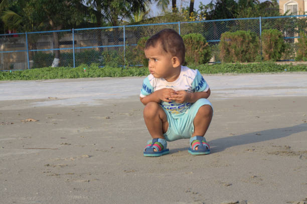 Beautiful little girl with Down syndromе playing