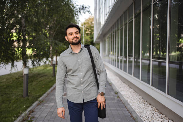 istock Portrait of white businessman on his way to work 1553665515