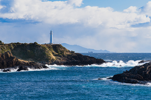 This scene of the Tsumekizaki Lighthouse caught my eye as it shows a cargo ship sailing out to sea from Tokyo Bay. As you can see, the area around this cape is extremely dangerous as many low/flat rocks are hidden below the waterline during high tide.