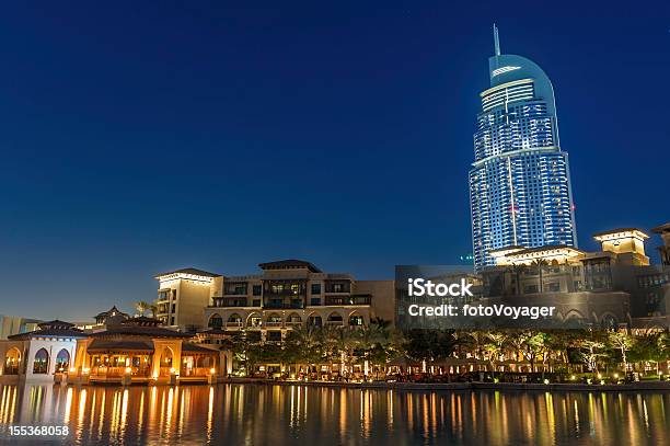Dubai High Rise Hotel Luxury Apartments Waterside Restaurants At Dusk Stock Photo - Download Image Now