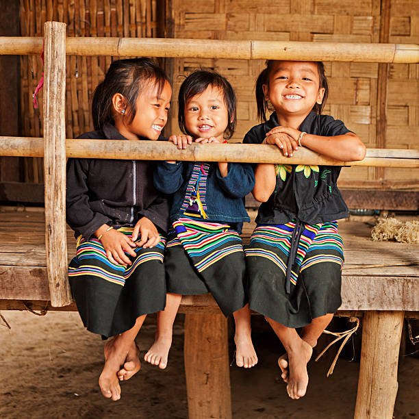 Three little girls in Northern Laos Three little girls having fun in the village in Northern Laos. laos photos stock pictures, royalty-free photos & images