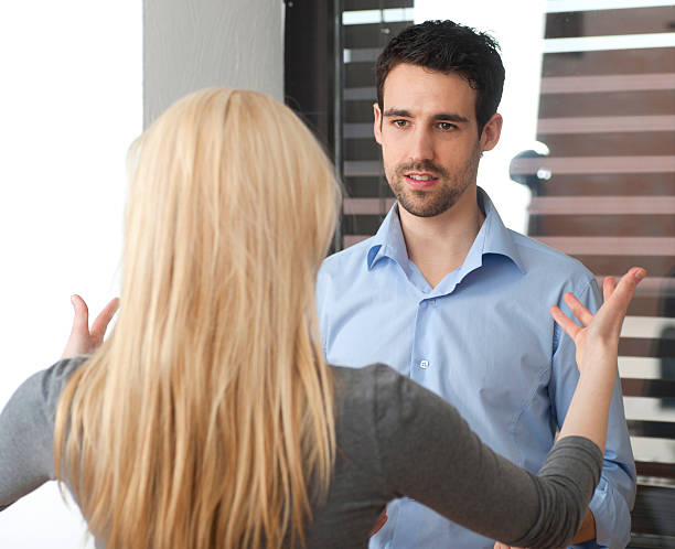 istock confrontation between a couple man and woman argue the dispute 155368870