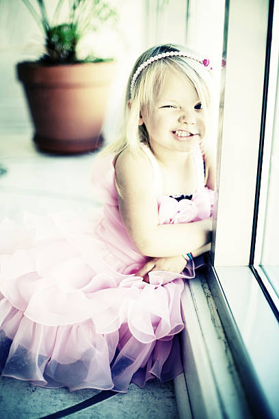 istock young american girl indoors dressed up 155368973