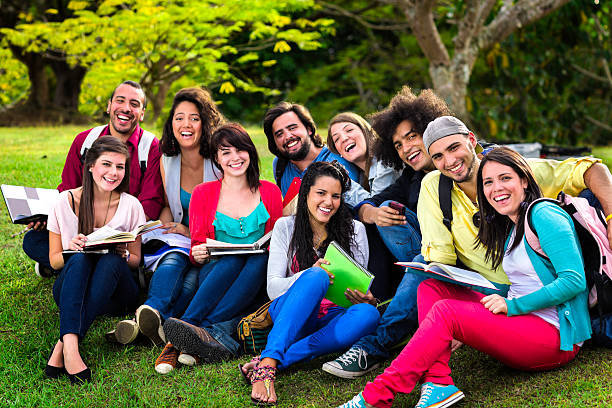 istock Multi-ethnic group of young students sharing at university campus 155369336