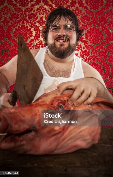 Butcher Cutting Pigs Head With Rusty Cleaver Smiling Stock Photo - Download Image Now