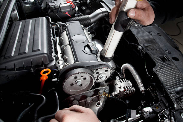 istock Mechanic is checking the timing belt of a modern car 155369547