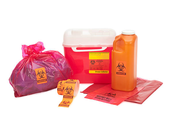 Bio-Waste with clipping path This image shows various forms of bio-waste including needle disposal container, liquid bodily waste, and bagged medical waste...all with bio-waste warnings. Background is 255 white with clipping path. toxic waste stock pictures, royalty-free photos & images