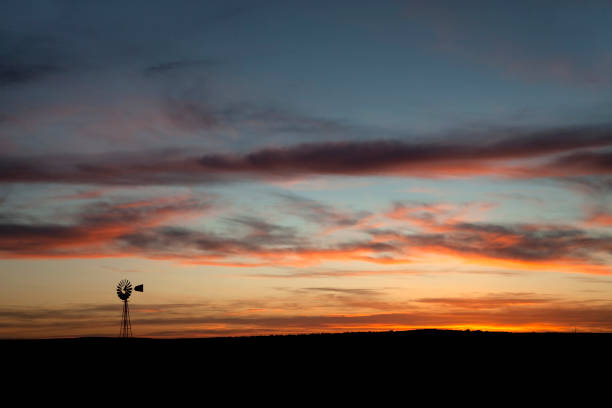 istock Windmill with Colorado sunset colors copy space 155370153