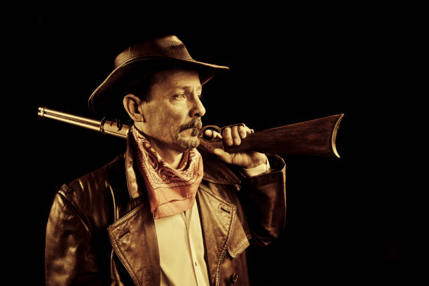 istock american cowboy with rifle 155370265