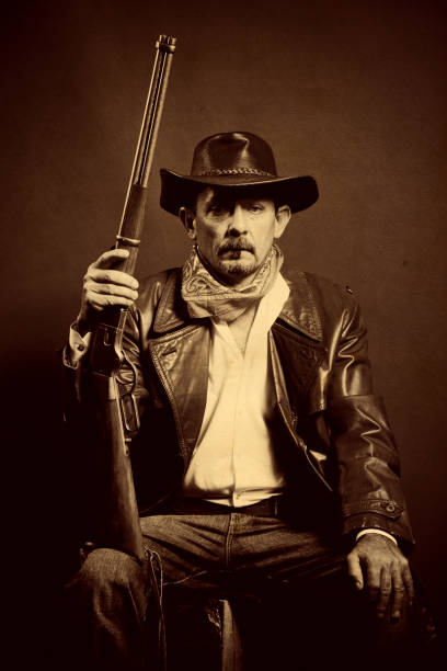 istock american cowboy with rifle 155370273