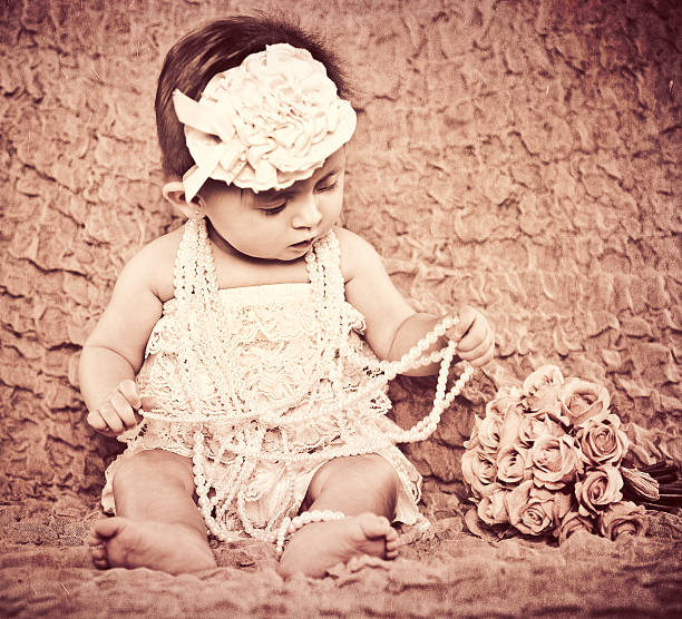 Beautiful newborn baby girl. New born child princess sleeping on white background