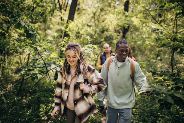 istock Group of friends hiking in nature 1553717523