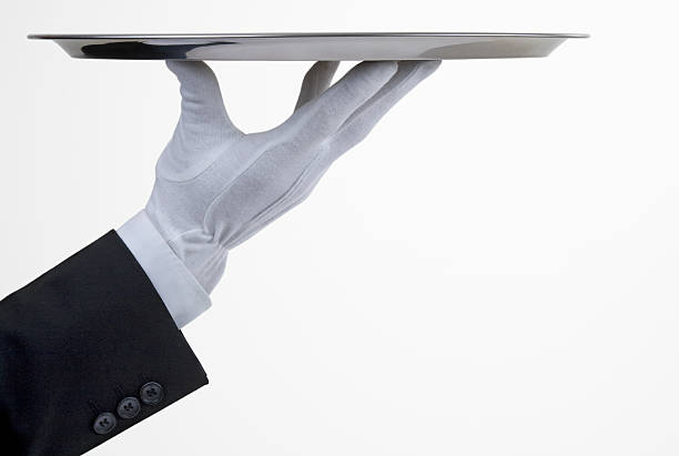 Silver tray with hand A butler serving with a silver tray your product formal glove stock pictures, royalty-free photos & images