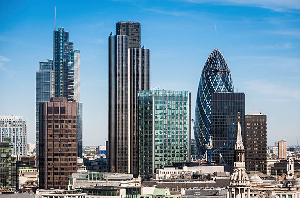 London Square Mile financial district skyscrapers High angle view over the landmark skyscrapers of the City of London Square Mile downtown financial district, the Heron Tower, Tower 42, Broadgate Tower and the Gherkin (30 St. Mary Axe). ProPhoto RGB profile for maximum color fidelity and gamut. tower 42 stock pictures, royalty-free photos & images