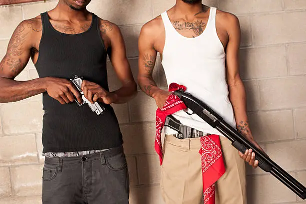 Photo of two gangbangers with guns