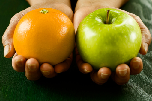 Comparing apple to orange exhibiting the idea of comparing two completely different things