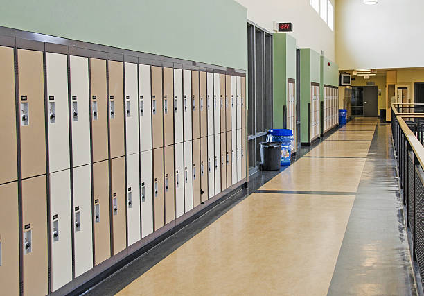 istock Tall brown lockers in an open school hallway 155372136