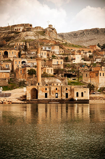 view of Halfeti old mosque by the Euphrates River in the sunken city Halfeti, Sanliurfa, Turkey halfeti stock pictures, royalty-free photos & images