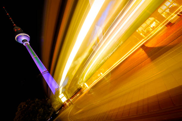 Television tower (Fernsehturm) in Alexanderplatz, Berlin, Germany, illuminated with color lights during the \